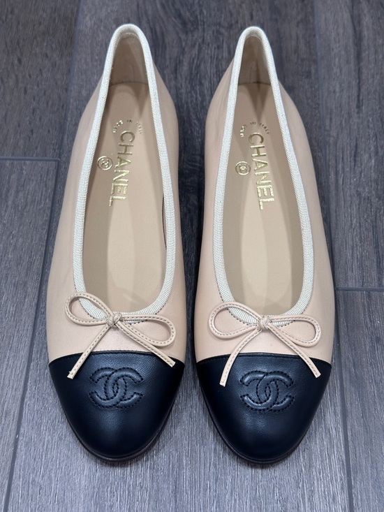 CHANEL Shoes - CHANEL Beige and Black Cap-Toe Ballet Flats